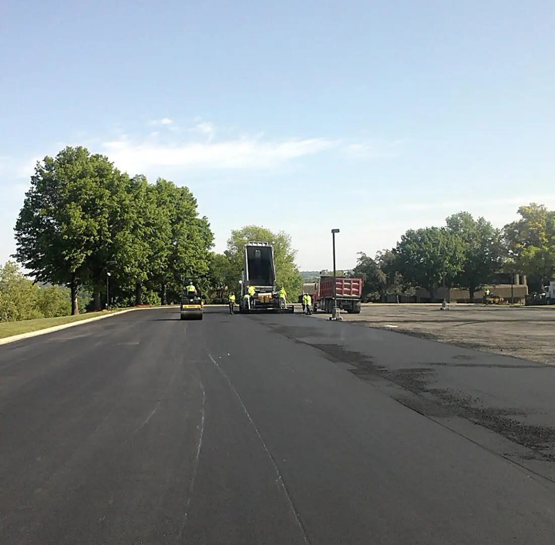 Workers paving a new asphalt road.