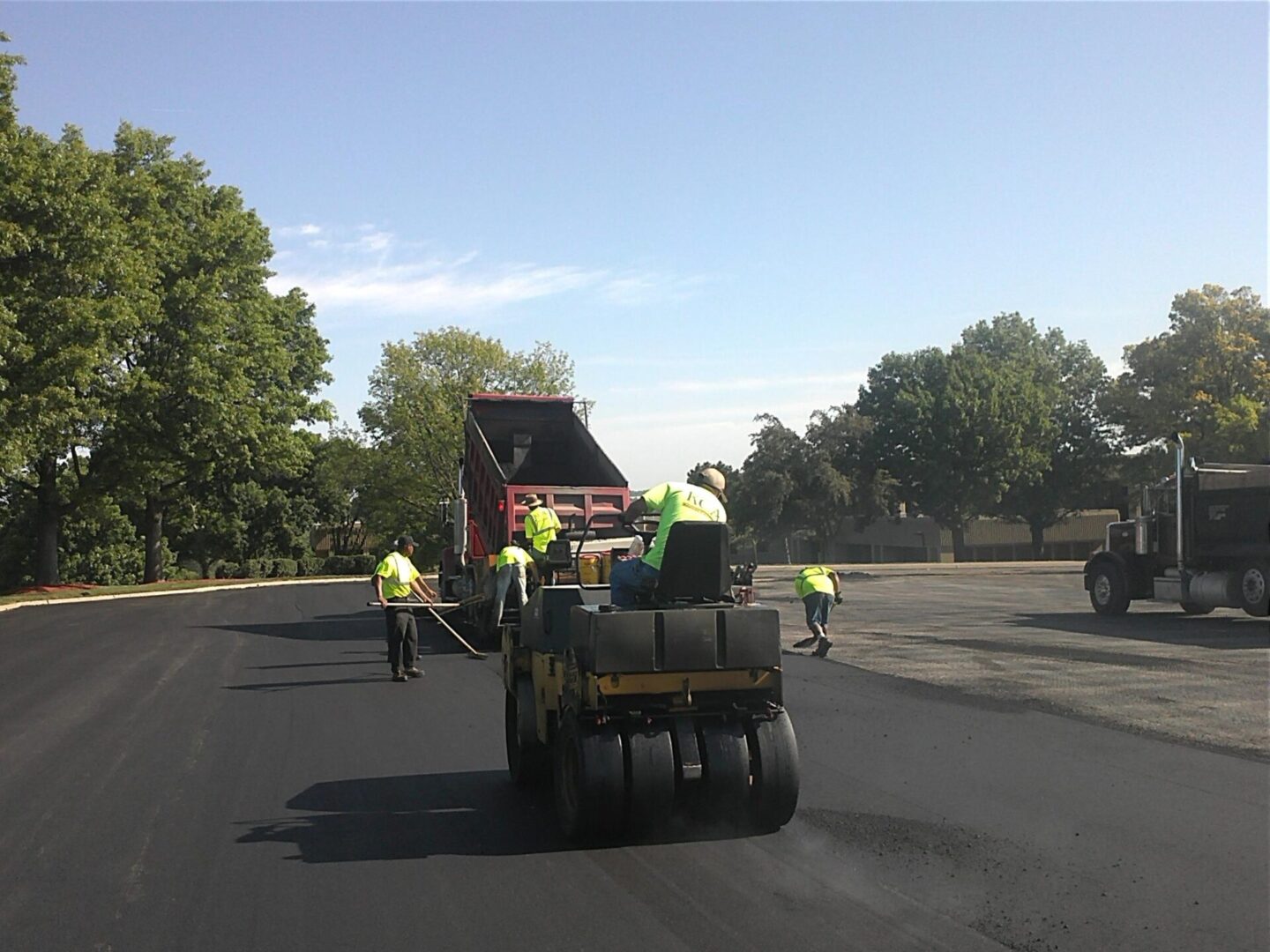 A group of men working on the road.